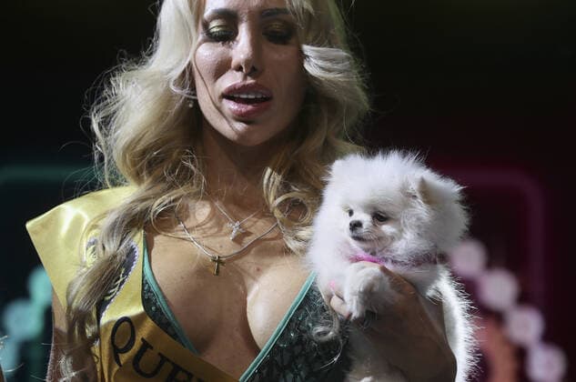 MOSCOW, RUSSIA â€“ SEPTEMBER 28, 2021: A dog with its owner Ksenia Davydova at a ceremony to present the 2021 Golden Pet Awards at the Federation Tower of the Moscow International Business Centre. Vladimir Gerdo TASS  TS1125AC