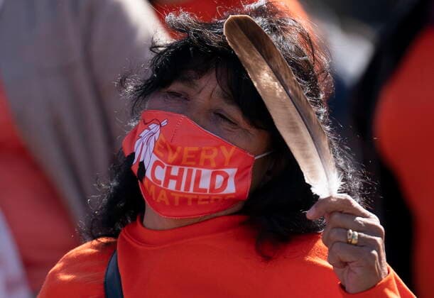 September 30, 2021, Ottawa, on, Canada: A woman holds an eagle feather as she listens to speakers during National Day for Truth and Reconciliation ceremonies on Parliament hill, Thursday, September 30, 2021 in Ottawa. Ottawa Canada  - ZUMAc35_ 20210930_zaf_c35_036 Copyright: xAdrianxWyldx