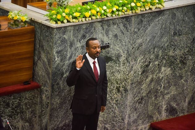 (211004) -- ADDIS ABABA, Oct. 4, 2021 -- Abiy Ahmed takes the oath as he is sworn in as Ethiopian prime minister in Addis Ababa, Ethiopia, on Oct. 4, 2021. Ethiopian parliament on Monday confirmed incumbent Abiy Ahmed as prime minister for a new five-year term. Abiy s Prosperity Party won a landslide victory in national elections held in June. He was sworn in as the country s prime minister Monday. ) ETHIOPIA-ADDIS ABABA-ABIY AHMED-PM-INAUGURATION MichaelxTewelde 