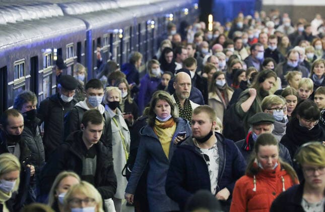 ST PETERSBURG, RUSSIA â€“ OCTOBER 6, 2021: Passengers get off the train at Prospekt Bolshevikov station of the St Petersburg Underground during an evening rush hour. Over the past 24 hours, 25,133 new cases of COVID-19 have been confirmed in Russia; for 5 days in a row more than 25,000 news cases of COVID-19 are being confirmed in Russia. Peter Kovalev TASS  TS1134C2