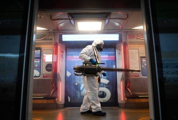 Russia Coronavirus Disinfection 6668271 08.10.2021 An employee wearing personal protective equipment (PPE) disinfects the interior of a metro car amid the coronavirus outbreak, in Moscow, Russia. Vladimir Astapkovich Sputnik Moscow Russia  Copyright: xVladimirxAstapkovichx