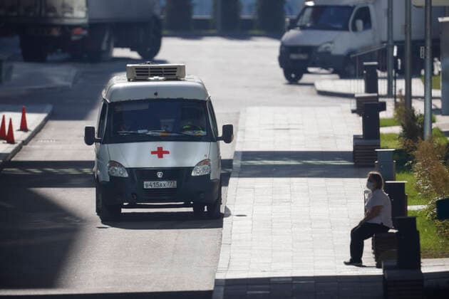 (211011) -- MOSCOW, Oct. 11, 2021 -- An ambulance is parked at a hospital in Kommunarka outside Moscow, Russia, Oct. 11, 2021. Russia registered 29,409 new coronavirus cases over the past 24 hours, the highest number so far this year, taking the nationwide tally to 7,804,774, the official monitoring and response center said Monday. (Photo by Xinhua) RUSSIA-MOSCOW-COVID-19-CASES AlexanderxZemlianichenkoxJr 