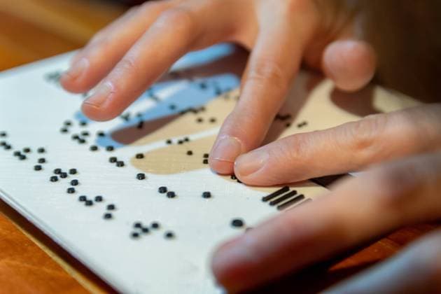 Woman hands reading braille text San Rafael, Mendoza Province, Argentina CR_CRCR210915-833191-01