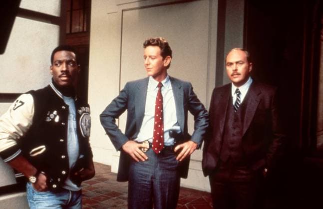 BEVERLY HILLS COP II, from left: Eddie Murphy, Judge Reinhold, John Ashton, 1987. ?Paramount Courtesy Everett Collection Ref:MSDBEHI PA006 PUBLICATIONXNOTxINxCANxCHNxFRAxITAxJPNxNORxPOLxRUSxESPxUKxUSA Copyright: xx MSDBEHI PA006