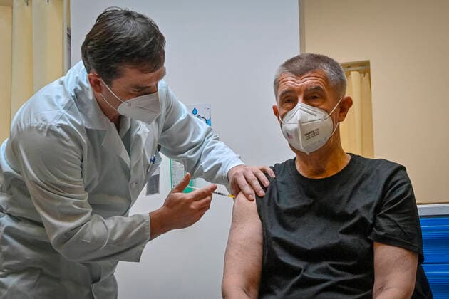 Czech Prime Minister Andrej Babis (ANO), right, receives third dose of COVID-19 vaccine at Central Military Hospital in Prague, Czech Republic, on October 14, 2021. (CTKxPhoto VitxSimanek) CTKPhotoP2021101403972  VIS 005 K