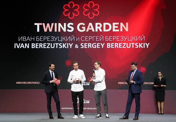 MOSCOW, RUSSIA - OCTOBER 14, 2021: Michelin Guides International Director Gwendal Poullennec, Twins Garden brother chefs Ivan and Sergei Berezutsky receiving two Michelin stars, and journalist Sergei Krasnov (L-R) attend a ceremony held at the Zaryadye Concert Hall to award Michelin stars to Moscow restaurants and chefs as well as to introduce the first Michelin Guide to Moscow. Vyacheslav Prokofyev TASS  TS1143D2