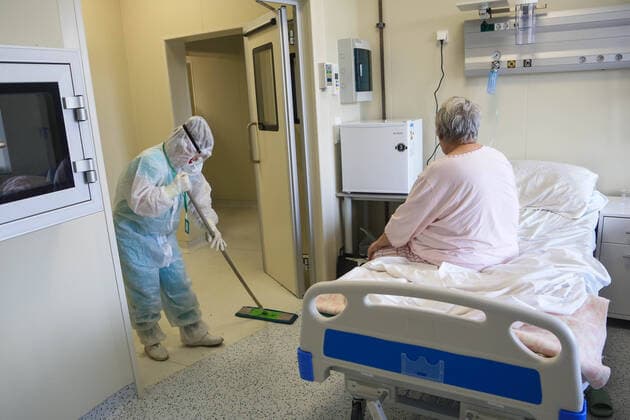 NOVOKUZNETSK, KEMEROVO REGION, RUSSIA - OCTOBER 14, 2021: A medical worker wipes the floor at a COVID-19 facility of Novokuznetsk City Clinical Infectious Diseases Hospital No 8. Yaroslav Belyayev TASS  TS114427