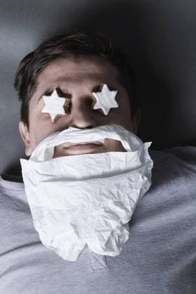 Drunken Man Laying on Grey Background with Cinnamon Stars on Eyes and Handkerchief Beard *** Drunken Man Laying on Grey Background with Cinnamon Stars on Eyes and Handkerchief Beard 1103400540