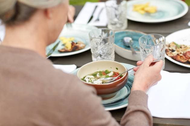 close up of woman eating soup in summer garden family, home, dinner, holidays and people concept - close up of woman eating soup in summer garden Copyright: xlevxdolgachovx 18942252