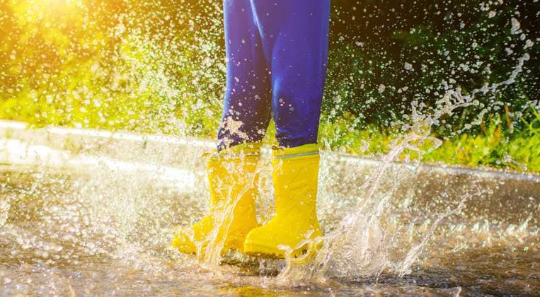 My rubber-booted feet are Bouncing in a puddle. Article about rubber boots. Children s summer shoes. Puddles after rain. Bad weather. A child jumps in a puddle. Happy childhood. A happy boy in rubber boots jumps in puddles. My rubber-booted feet are Bouncing in a puddle. Article about rubber boots. Children s summer shoes. Puddles after rain. Bad weather. A child jumps in a puddle. A happy boy in rubber boots jumps in puddles. Copyright: xx 36645154