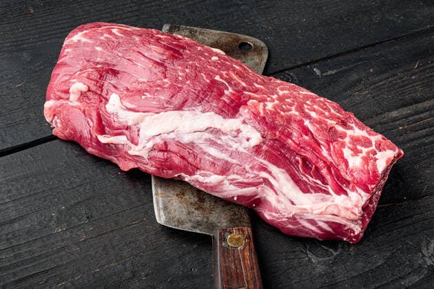 Fresh and raw beef meat. Whole piece of tenderloin with steaks , with old butcher cleaver knife, on black wooden table background Fresh and raw beef meat. Whole piece of tenderloin with steaks set , with old butcher cleaver knife, on black wooden table background Copyright: xx 37255782