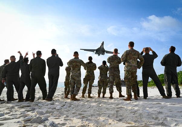 Airmen from the 28th Bomb Wing, Ellsworth Air Force Base, S.D., watch as a B-1B Lancer lands at Naval Support Facility Diego Garcia in support of a Bomber Task Force mission, Oct. 17, 2021. The U.S. Air Force routinely deploys a variety of aircraft and units throughout the Indo-Pacific area of operations in support of geographic combatant command objectives and training. () Where: Diego Garcia Naval Support Facility, British Indian Ocean Territory When: 17 Oct 2021 Credit: USAF Cover-Images.com **Editorial Use Only** Copyright: xx 50791239 EDITORIAL USE ONLY. NOT FOR USE BY NEWSPAPERS BASED IN THE UK.