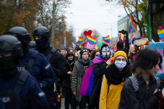 3rd Lublin Pride Parade Riot police officers walk along the pride parade participants during the Lublin pride parade on October 23, 2021 in Lublin, Poland. Several hundreds of people participated in the 3rd Lublin Pride parade marching through the city in a halloween themed parade. Lublin Poland Copyright: xAleksanderxKalkax