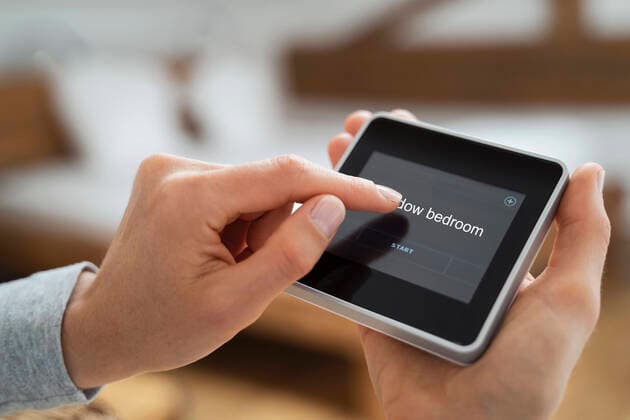 Woman using touch screen smart home device model released Symbolfoto property released DIGF16582