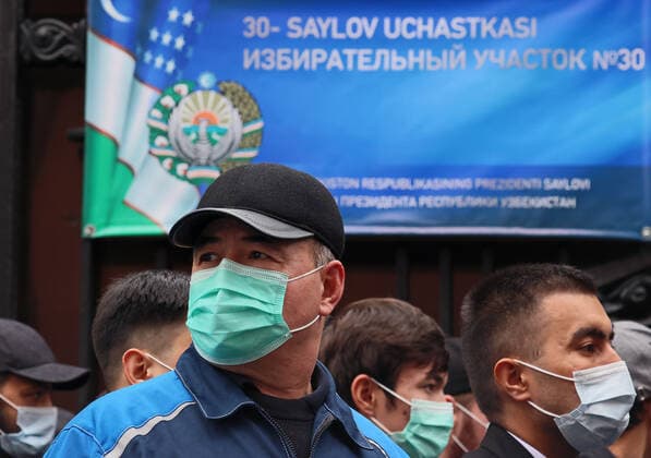 MOSCOW, RUSSIA - OCTOBER 24, 2021: People queue outside Polling Station No 30 at the Uzbek Embassy in Moscow to vote in the 2021 Uzbek presidential election. Uzbek citizen can cast their votes at polling stations in seven Russian cities. Sergei Savostyanov TASS  TS1157BF