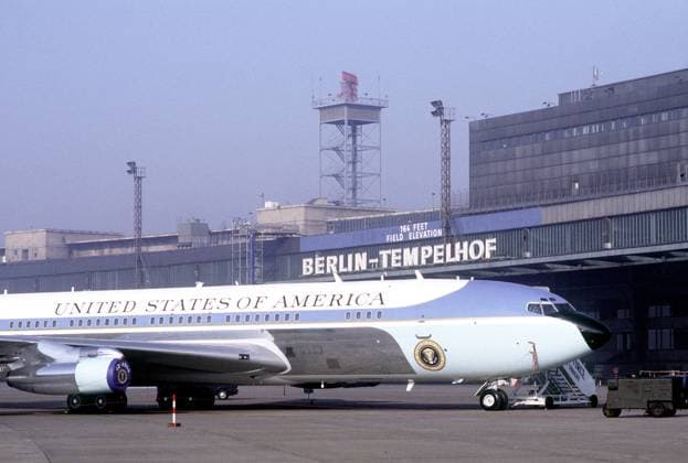 Air Force One, the VC-137C Stratoliner aircraft used to transport the president, sits in a roped-off area near the terminal building at Tempelhof Central Airport during President Reagan s visit to Berlin. _ _ 1062_05_L_-1443-