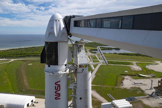 A SpaceX Falcon 9 rocket with the company s Crew Dragon spacecraft onboard is seen after being raised into a vertical position on the launch pad at Launch Complex 39A as preparations continue for the Crew-3 mission, on October 27, 2021, at NASA s Kennedy Space Center in Florida. NASA s SpaceX Crew-3 mission is the third crew rotation mission of the SpaceX Crew Dragon spacecraft and Falcon 9 rocket to the International Space Station as part of the agency s Commercial Crew Program. NASA astronauts Raja Chari, Tom Marshburn, Kayla Barron, and ESA (European Space Agency) astronaut Matthias Maurer are scheduled to launch on October 31 at 2:21 a.m. ET, from Launch Complex 39A at the Kennedy Space Center.  WAX2021102706 SPACEX
