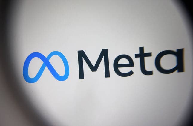 Facebook Renames Itself To Meta Meta Platforms Inc. logo is pictured through a magnifying glass in this illustrative photo taken in Kyiv on 29 October, 2021. Facebook renames itself to new company brand Meta, Chief of Facebook Mark Zuckerberg said on 28 October 2021. Kyiv Ukraine  Copyright: xSTRx sindeyev-notitle211029_npj4p