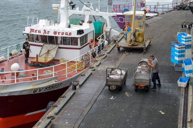 August 2, 2017, Bretagne, France: French fishing boats are seen docked to unload fish in the port of Le Guilvinec in Brittany..France is threatening the UK with retaliation in their dispute over fishing quotas. French fishermen are demanding that the British government respect its commitments to grant access to British waters negotiated as part of the Brexit. Bretagne France - ZUMAs197 20170802_zaa_s197_016 Copyright: xLaurentxCoustx