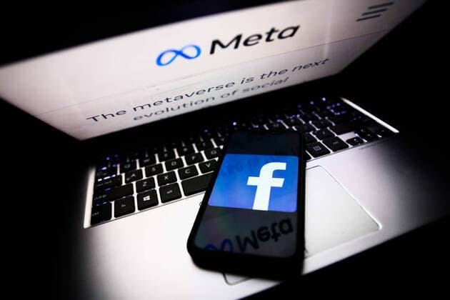 Meta Announced As The New Name Of Facebook Company Meta website displayed on a laptop screen and Facebook app logo displayed on a phone screen are seen in this illustration photo taken in Krakow, Poland on October 28, 2021. Mark Zuckerberg announced during Facebook Connect event that the new name of Facebook company will be Meta. Krakow Poland  Copyright: xJakubxPorzyckix porzycki-metaanno211028_npJjx