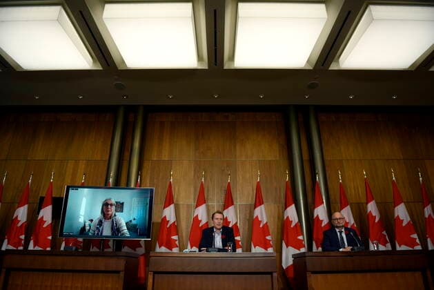 October 29, 2021, Ottawa, ON, CAN: Minister of Crown-Indigenous Relations Marc Miller, centre, Minister of Justice David Lametti and and Minister of Indigenous Services Patty Hajdu, appearing via video conference at left, participate in a news conference regarding the order from the Canadian Human Rights Tribunal to compensate Indigenous children and their families, in Ottawa, on Friday, Oct. 29, 2021. Ottawa CAN  - ZUMAc35_ 20211029_zaf_c35_153 Copyright: xJustinxTangx