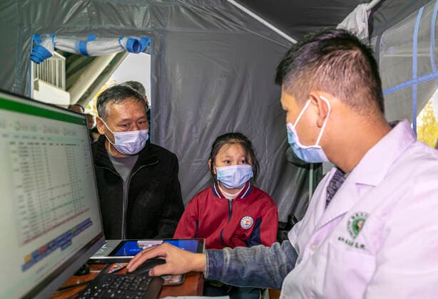 (211101) -- QIANXI, Nov. 1, 2021 -- A young student gets registered for COVID-19 vaccination at a vaccination site in Qianxi City, southwest China s Guizhou Province, Nov. 1, 2021. Qianxi City on Monday launched a COVID-19 vaccination campaign for children aged 3 to 11. (Photo by Xinhua) CHINA-GUIZHOU-QIANXI-CHILDREN-COVID-19-VACCINATION (CN) FanxHui 