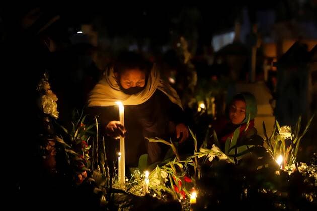 A woman visits a late beloved one at a cemetery in the town of Xochitlan Todos Santos, in Puebla state, Mexico, late 01 November 2021. Mexicans visit their beloved ones tombs to decorate them and wait the arrival of deceased ones souls in a tradition that could not follow due to COVID-19 pandemic. Mexicans visit cemeteries to mark Day of the Dead !ACHTUNG: NUR REDAKTIONELLE NUTZUNG!  Copyright: xHildaxRiosx MEX5853 20211102-0767c55ae4321c99fd3e70625e181b3c3ba0cc7d