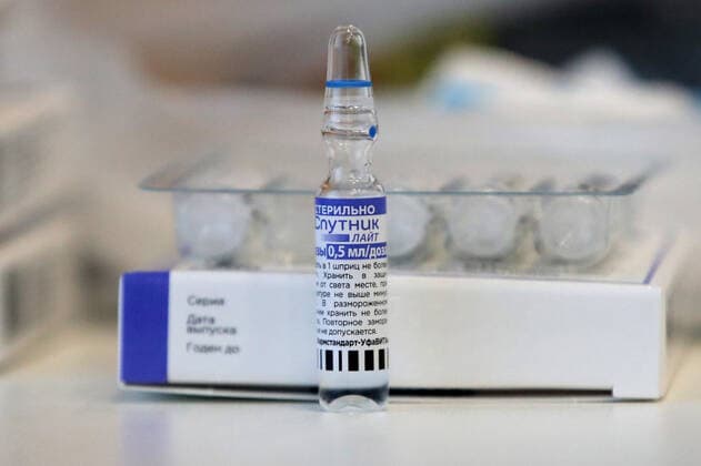 NOVOSIBIRSK, RUSSIA - NOVEMBER 3, 2021: An ampoule with the Sputnik Light vaccine is seen during vaccination of employees of the River Park Hotel. A medical team holds onsite COVID-19 vaccination with the Gam-COVID-Vac (Sputnik V) and Sputnik Light vaccines. Kirill Kukhmar TASS  TS116A62