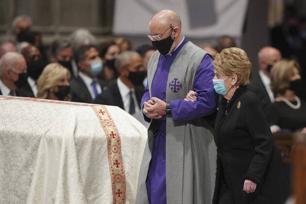 Madeleine Albright, former U.S. secretary of state, is escorted while attending the funeral for Colin Powell, former secretary of state, at Washington National Cathedral in Washington, D.C., U.S., on Friday, Nov. 5, 2021. Powell, who was born in Harlem to Jamaican immigrants and rose to become the U.S. s first Black secretary of state and chairman of the Joint Chiefs of Staff, died at 84 due to complications from Covid-19.  WASP202110531 AlxDrago