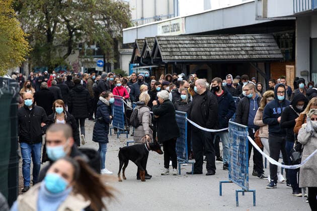 Lnes for the coronavirus vaccination at the Zagreb Fair Citizens are seen waiting in lines at the Zagreb Fair for vaccination with the 1st and 2nd dose of the vaccine. The official confirmation of the headquarters has arrived that today is the day with the most deaths from coronavirus, as well as the largest number of infected people since the beginning of the pandemic. In the last 24 hours, 7,094 new cases of SARS-CoV-2 virus infection were recorded, and the number of active cases in Croatia today is a total of 31,689. Among them, 1,786 patients are in hospital treatment, of which 234 patients are on respirators., in Zagreb, Croatia, on November 06, 2021. ZeljkoxHladika PIXSELL