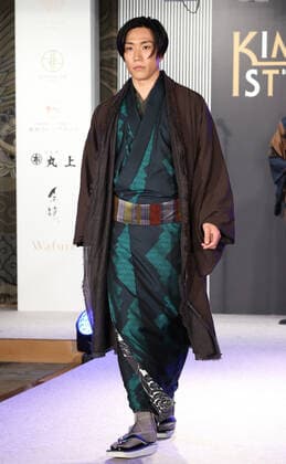 November 9, 2021, Tokyo, Japan - Japanese actor Taichi Saotome displays kimono as he receives the first Kimonoist award for the promotion of Japanese traditional dresses in Tokyo on Tuesday, November 9 2021.  (173989252)