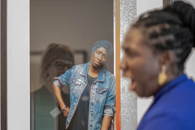 November 9, 2021, London, England, United Kingdom: Cromwell Place, South Kensington, London, UK. Photographer Philippa James reflected on the frame of her portrait of the refugee woman she is talking to. It is on display at Cromwell Place from 10th of November 2021 until 2nd of January 2022. The exhibition features the winning and shortlisted portraits of the prestigious Taylor Wessing Photographic Portrait Prize - 54 portraits from 25 different artists.Ã‚ .Photographer David Prichard has won the first prize for his Tribute to Indigenous Stock Women, a series of portraits of First Nations women who spent most of their working lives on cattle stations in Far North Queensland..The second prize has been awarded to Pierre-Elie de Pibrac for Ha - ZUMAm203 20211109_zip_m203_007 Copyright: xSabrinaxMerollax