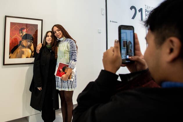 November 9, 2021, London, England, United Kingdom: Cromwell Place, South Kensington, London, UK. Deleli Ayivi poses with her portrait on display at London Cromwell Place for the prestigious Taylor Wessing Photographic Portrait Prize. The exhibition runs from 10th of November 2021 until 2nd of January 2022. It features 54 portraits from 25 different artists. Ã‚ .Photographer David Prichard has won the first prize for his Tribute to Indigenous Stock Women, a series of portraits of First Nations women who spent most of their working lives on cattle stations in Far North Queensland..The second prize has been awarded to Pierre-Elie de Pibrac for Hakanai Sonzai, a series of portraits of people s fortitude in the face of adversity taken in Japan. - ZUMAm203 20211109_zip_m203_010 Copyright: xSabrinaxMerollax