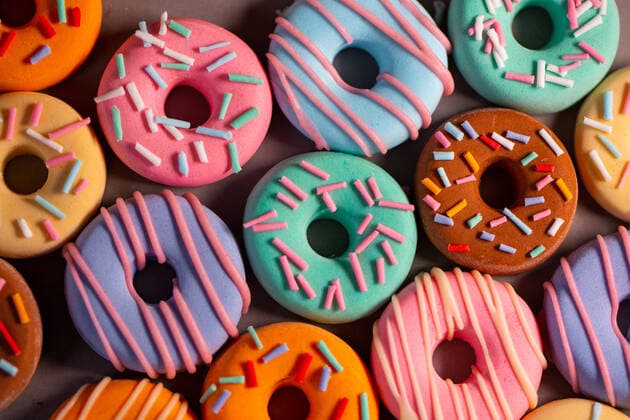 Donats from sugar paste. Multi-colored sugar art cakes. Different types of colorful Donats decorated sprinkles and icing. Cake art concept image Copyright: xDmytroxNikolaienkox