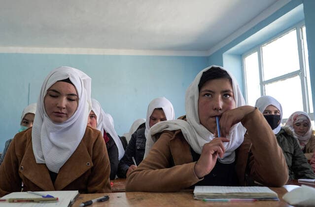 BAMYAN, AFGHANISTAN - NOVEMBER 8, 2021: Twelfth-grade pupils attend a lesson at a secondary school for girls. Upon the withdrawal of US troops from Afghanistan, the Taliban movement (banned in Russia) declared the establishment of its control over the whole country on September 6, a new government formed a day later. Among other reforms, the Taliban have also introduced a number of restrictions concerning education and employment for girls and women. Alexandra Kovalskaya TASS  TS117773