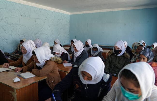 BAMYAN, AFGHANISTAN - NOVEMBER 8, 2021: Twelfth-grade pupils attend a lesson at a secondary school for girls. Upon the withdrawal of US troops from Afghanistan, the Taliban movement (banned in Russia) declared the establishment of its control over the whole country on September 6, a new government formed a day later. Among other reforms, the Taliban have also introduced a number of restrictions concerning education and employment for girls and women. Alexandra Kovalskaya TASS  TS117775