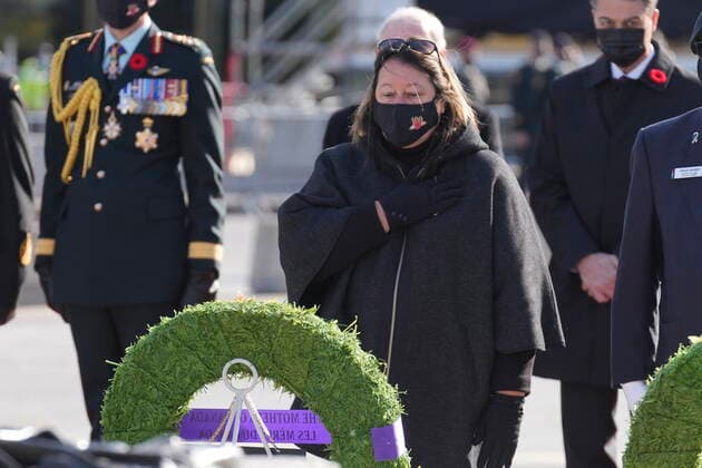 November 11, 2021, Ottawa, ON, Canada: Silver Cross Mother Josee Simard takes a moment after placing a wreath during Remembrance Day services at the National War Memorial in Ottawa on Thursday, Nov. 11, 2021. Ottawa Canada  - ZUMAc35_ 20211111_zaf_c35_028 Copyright: xAdrianxWyldx