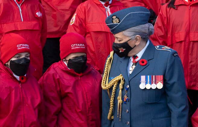 November 11, 2021, Ottawa, ON, Canada: Gov. Gen. Mary Simon speaks with a member of the Ottawa Youth Choir following the Remembrance Day ceremony at the National War Memorial, Thursday, November 11, 2021 in Ottawa. Ottawa Canada  - ZUMAc35_ 20211111_zaf_c35_104 Copyright: xAdrianxWyldx