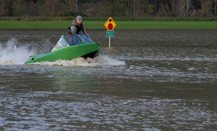 November 16, 2021, CHILLIWACK, BC, CANADA: A man drives a boat down a flooded road in Chilliwack, B.C., Tuesday, November 16, 2021. CHILLIWACK CANADA  - ZUMAc35_ 20211116_zaf_c35_029 Copyright: xJonathanxHaywardx