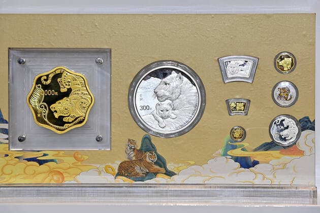 (211118) -- BEIJING, Nov. 18, 2021 -- The commemorative coins to celebrate the Chinese zodiac Year of the Tiger are pictured in Beijing, capital of China, Nov. 18, 2021. China s central bank issued a set of gold and silver commemorative coins on Thursday to celebrate the Chinese zodiac Year of the Tiger. The set consists of eight gold and five silver coins, all of which will be legal tender in China, the People s Bank of China said in an online statement. ) CHINA-COMMEMORATIVE COIN-YEAR OF THE TIGER (CN) LixXin 