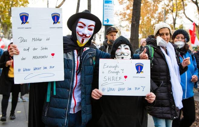 Austria Coronavirus Restrictions Protest 6700618 20.11.2021 People hold placards during a rally against COVID-19 lockdown and mandatory vaccination, in Vienna, Austria. Thousands of protesters have gathered in Austria?s capital after the government announced a nationwide lockdown to contain the quickly rising coronavirus infections and said vaccines would be made compulsory starting February 1. Stringer Sputnik Vienna Austria  Copyright: xStringerx