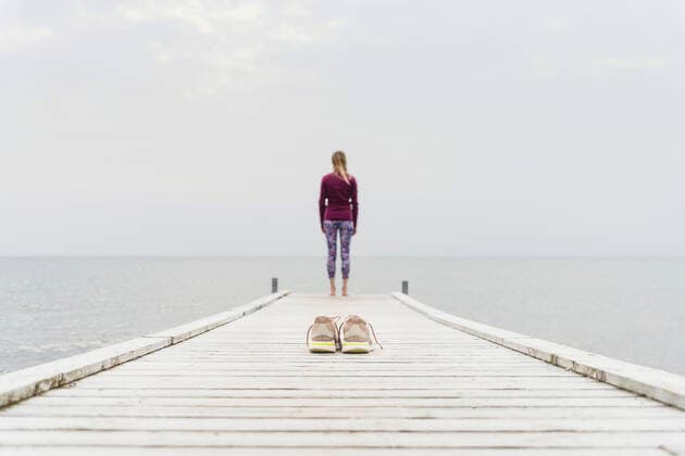Woman looking at sea while standing on pier model released, CHPF00793