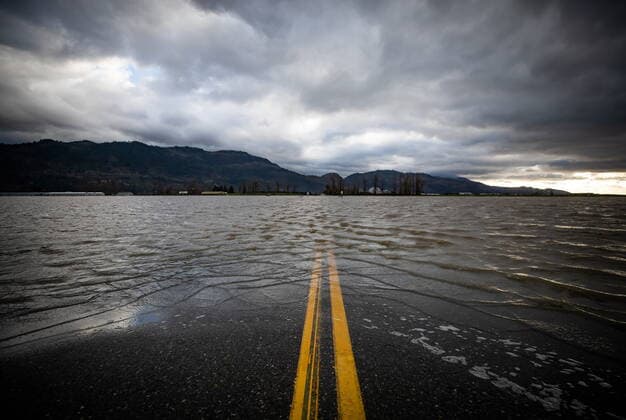 November 23, 2021, ABBOTSFORD, BC, Canada: Floodwaters cover a road that runs through farmland in Abbotsford, B.C., Tuesday, Nov. 23, 2021. ABBOTSFORD Canada  - ZUMAc35_ 20211123_zaf_c35_212 Copyright: xDarrylxDyckx