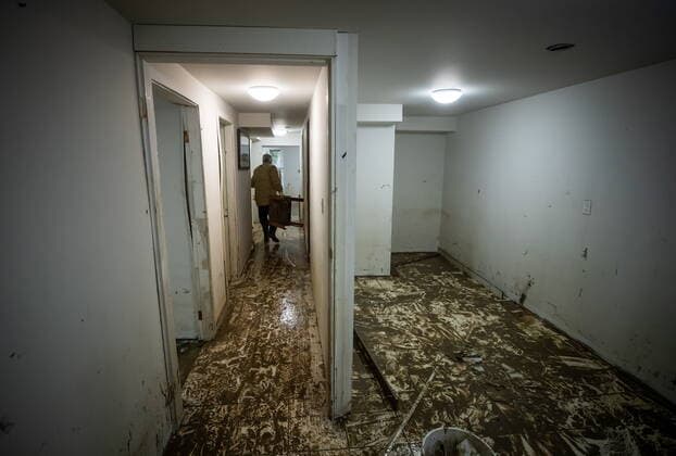 November 23, 2021, ABBOTSFORD, BC, Canada: A farm manager,who asked not to be identified by name, removes damaged items after floodwaters filled the lower floor of a house the family rents on a farm, in Abbotsford, B.C., Tuesday, Nov. 23, 2021. ABBOTSFORD Canada - ZUMAc35_ 20211123_zaf_c35_220 Copyright: xDarrylxDyckx