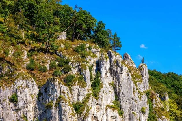 Crown rocks - Skaly Koronne - Jurassic limestone mountain massif with Glove Rock - Rekawica - in Pradnik creek valley of Cracow-Czestochowa upland in Lesser Poland  BEW1DDC3F0A