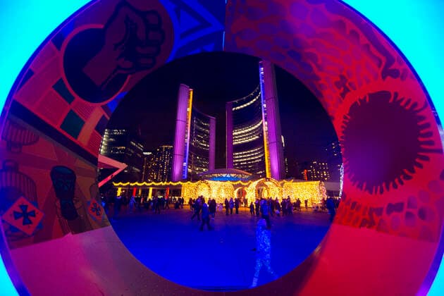 (211128) -- TORONTO, Nov. 28, 2021 -- People visit the 2021 Cavalcade of Lights in Toronto, Canada, Nov. 27, 2021. The annual light show in Toronto kicked off on Saturday and will last until Jan. 2, 2022. (Photo by Xinhua) CANADA-TORONTO-LIGHT SHOW ZouxZheng 