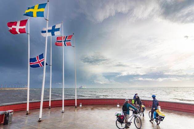 flags of the nordic countries Iceland, Norway, Sweden, Finland and Denmark, strait Öresund, on island Parapeten, cyclists Helsingborg Skane län, Scania, Schonen Sweden