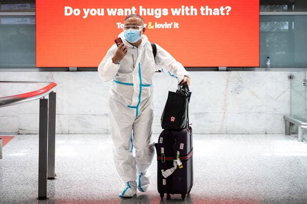 NSW COVID19 OMICRON STRAIN, People wearing PPE arriving at Sydney International Airport in Sydney, Monday, November 29, 2021. The Omicron COVID-19 variant has arrived in Australia after testing confirmed two overseas travellers who arrived in Sydney were infected with the new strain. ( NO ARCHIVING, EDITORIAL USE ONLY, NO USE IN BOOKS WITHOUT CONSENT SYDNEY NSW AUSTRALIA  Copyright: xJAMESxGOURLEYx 20211129001601268517
