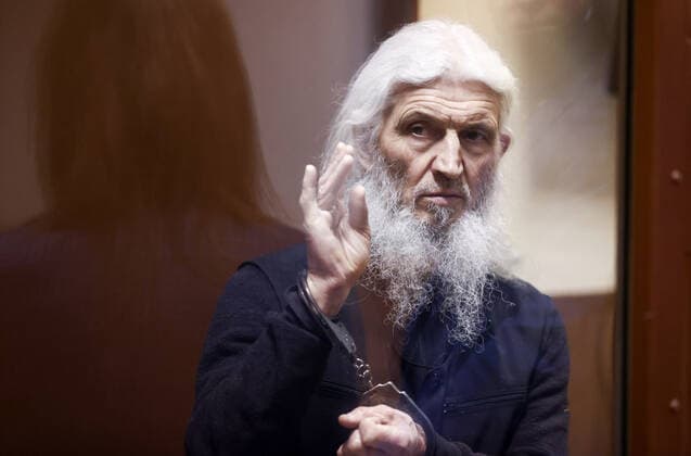 MOSCOW, RUSSIA - NOVEMBER 30, 2021: Unordained schema hegumen Sergius (Nikolai Romanov), charged with unsanctioned actions encouraging people to kill themselves and violating the right for freedom of religion over his calling on the faithful to oppose COVID-19 restrictions, attends a sententing hearing at Moscowâ€™s Izmailovsky District Court. Romanov was arrested at the Sredneuralsk Convent and sent to Moscow on 29 December 2020; he was excommunicated in May 2020 for violating a ban on preaching after calling on people to go to church despite the lockdown, describing the coronavirus situation as a fake pandemic . More recently, Sergius was stripped of his rank by the Yekaterinburg Eparchy Court and ordered to leave the convent but continued  TS11A157