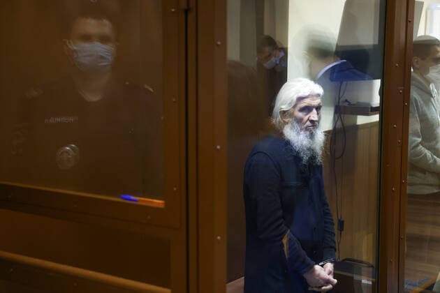 MOSCOW, RUSSIA - NOVEMBER 30, 2021: Unordained schema hegumen Sergius (Nikolai Romanov), charged with unsanctioned actions encouraging people to kill themselves and violating the right for freedom of religion over his calling on the faithful to oppose COVID-19 restrictions, attends a sententing hearing at Moscowâ€™s Izmailovsky District Court. The court found Romanov guilty on the three charges and sentenced him to 3 and a half years in prison colony. Romanov was arrested at the Sredneuralsk Convent and sent to Moscow on 29 December 2020; he was excommunicated in May 2020 for violating a ban on preaching after calling on people to go to church despite the lockdown, describing the coronavirus situation as a fake pandemic . More recently, Serg  TS11A15D